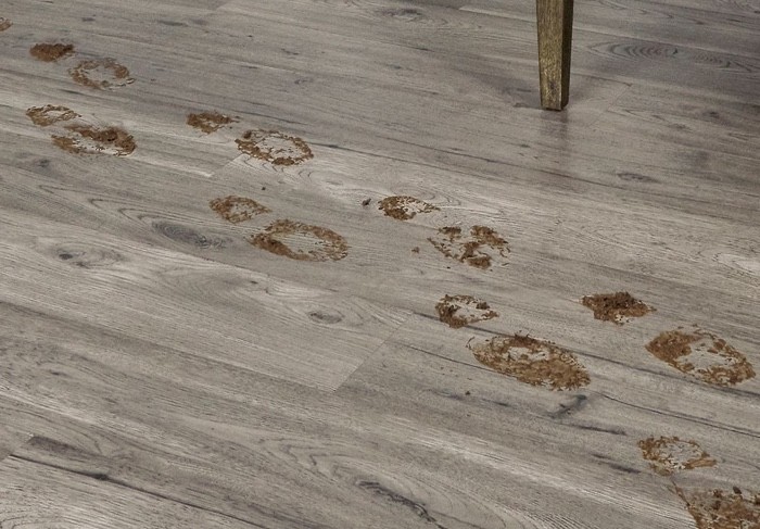 dirty footprints across laminate flooring | The Floor Store | San Francisco Bay Area