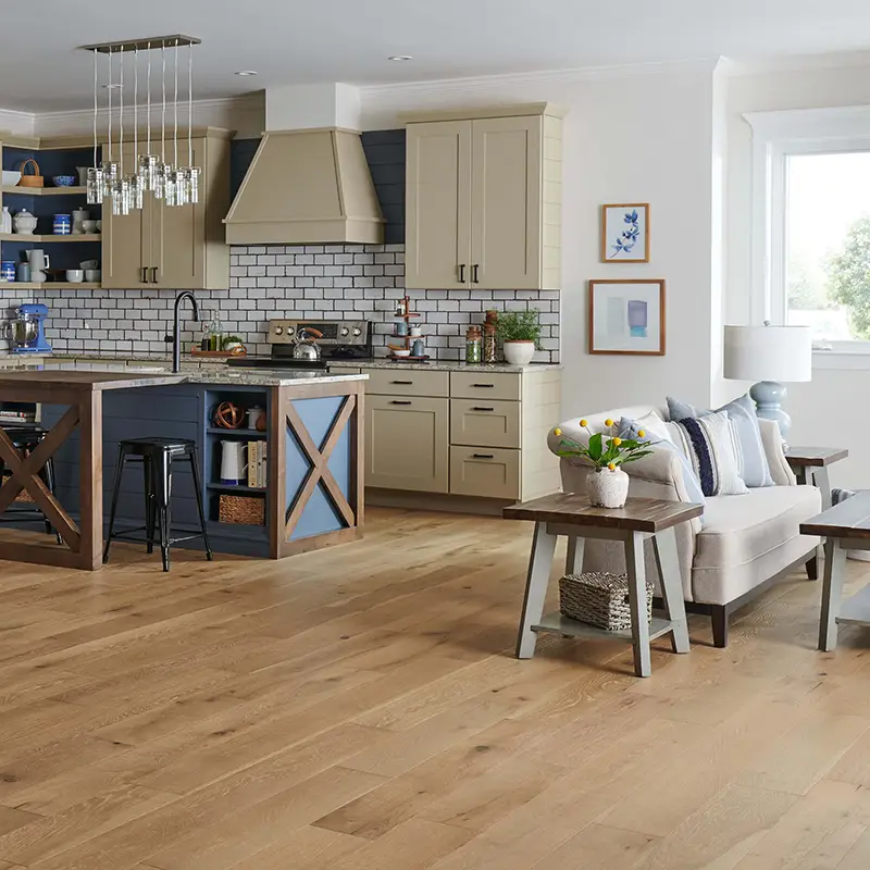 open floor plan home with light colored, neutral wood flooring 