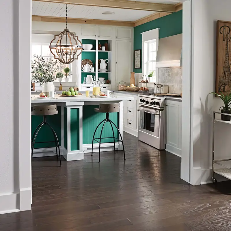 kitchen with bold colors and darker wood flooring 