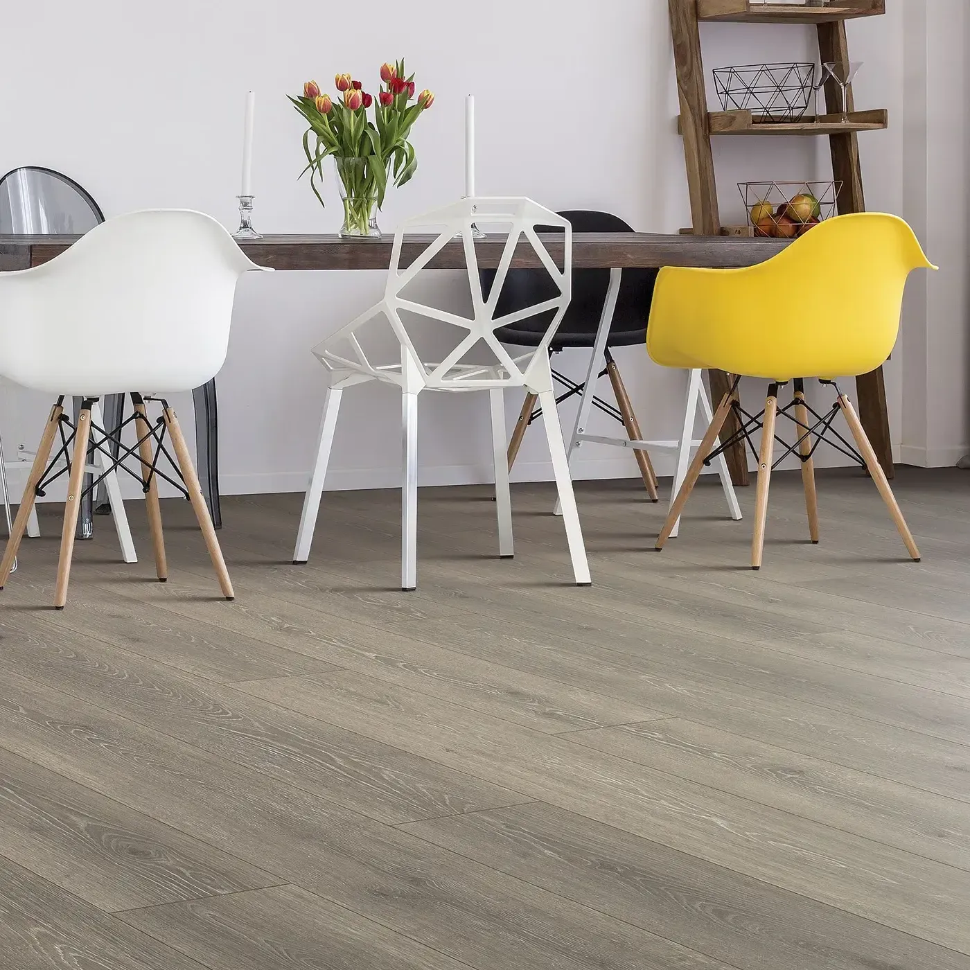 33634_06W_room Laminate in a gray-brown wood tone in a modern dining room | The Floor Store