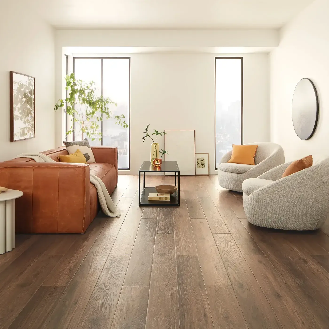 VV735_03018_ROOM COREtec Luxury Vinyl in a dark brown wood tone in a bright living room | The Floor Store