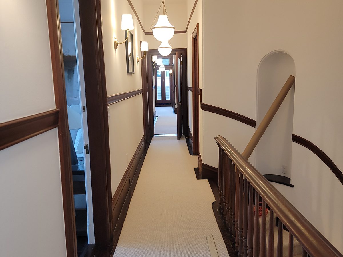 Custom wall-to-wall carpet in a curved hallway