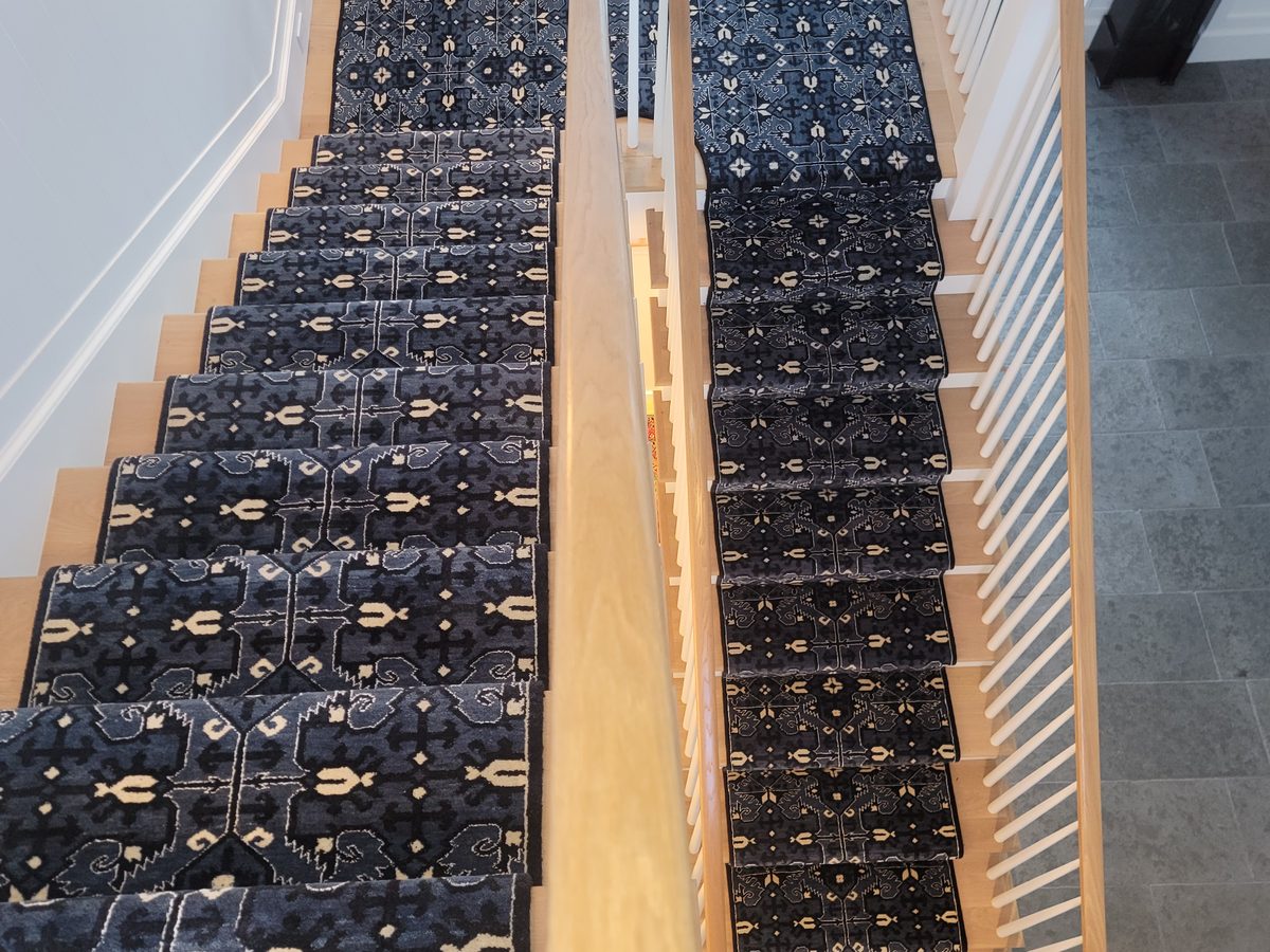 Blue patterned carpet on stairs and landing