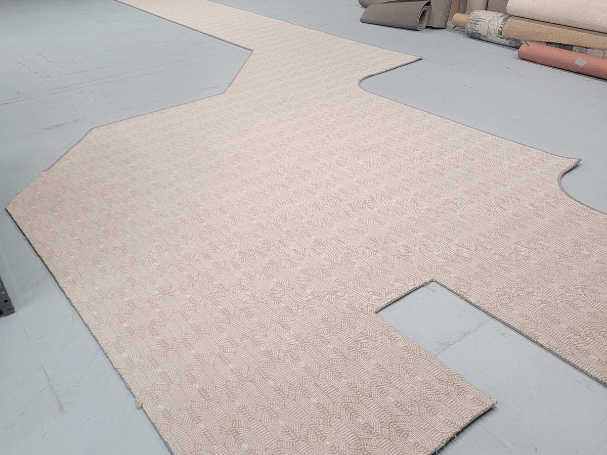 Carpet cut to a custom template in the binding shop