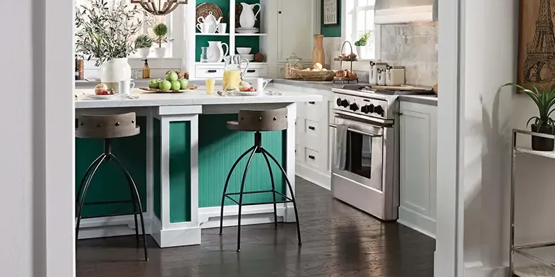 kitchen with bold colors and darker wood flooring